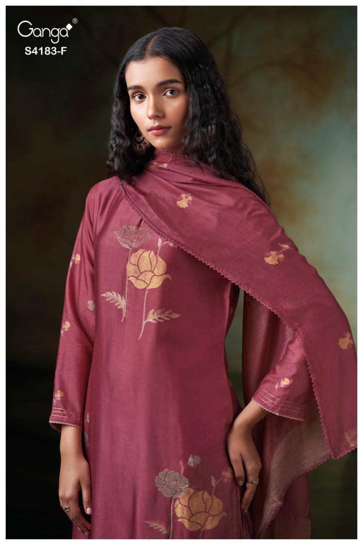 Woman wearing a maroon traditional outfit with floral patterns on a dark background