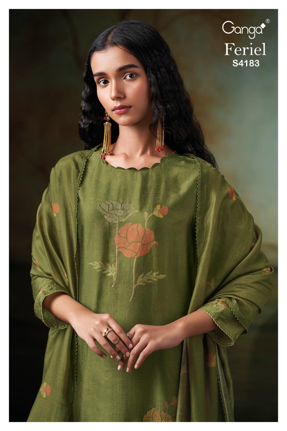 Woman wearing a green embroidered dress with 'Ganga' branding