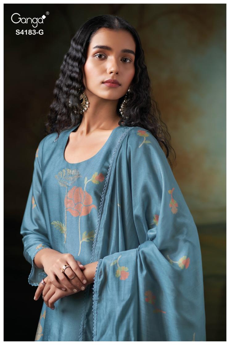 Woman wearing a blue embroidered saree with a blurred background